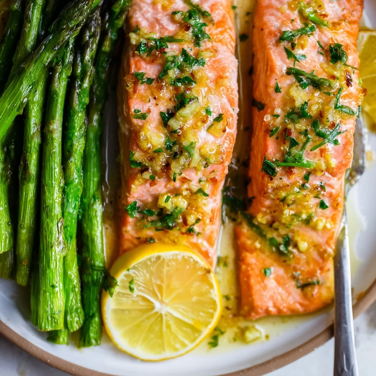 A fragrant One-Pan Lemon Garlic Salmon with Asparagus, perfect for a quick weeknight dinner.  
