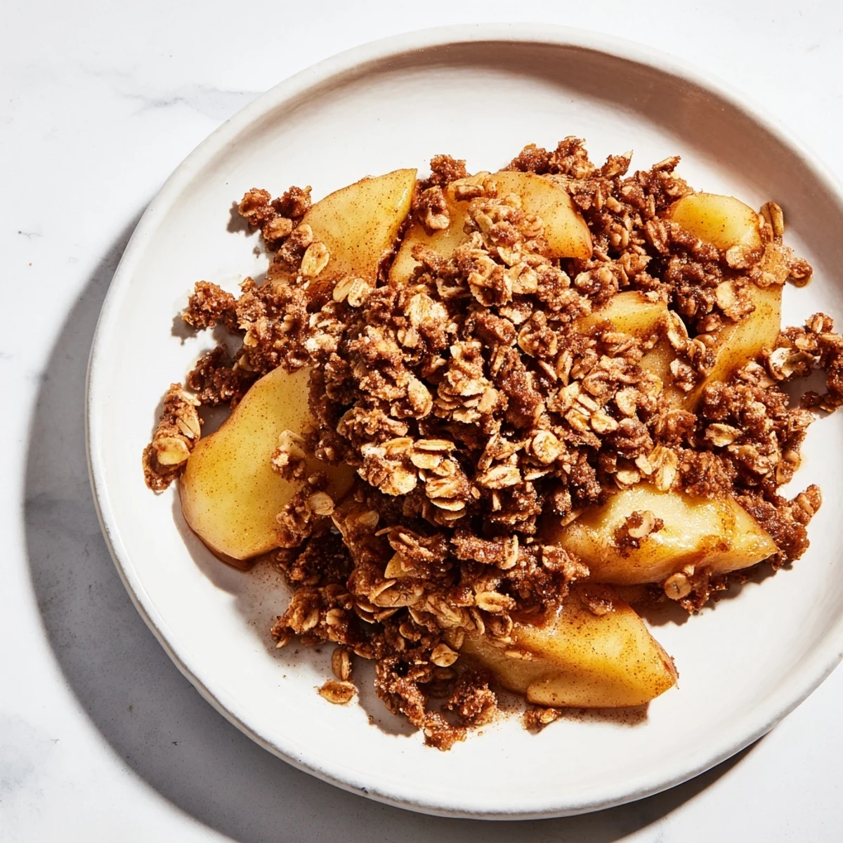Golden-brown Apple Crisp with a bubbling sweet filling, perfect for dessert tonight.