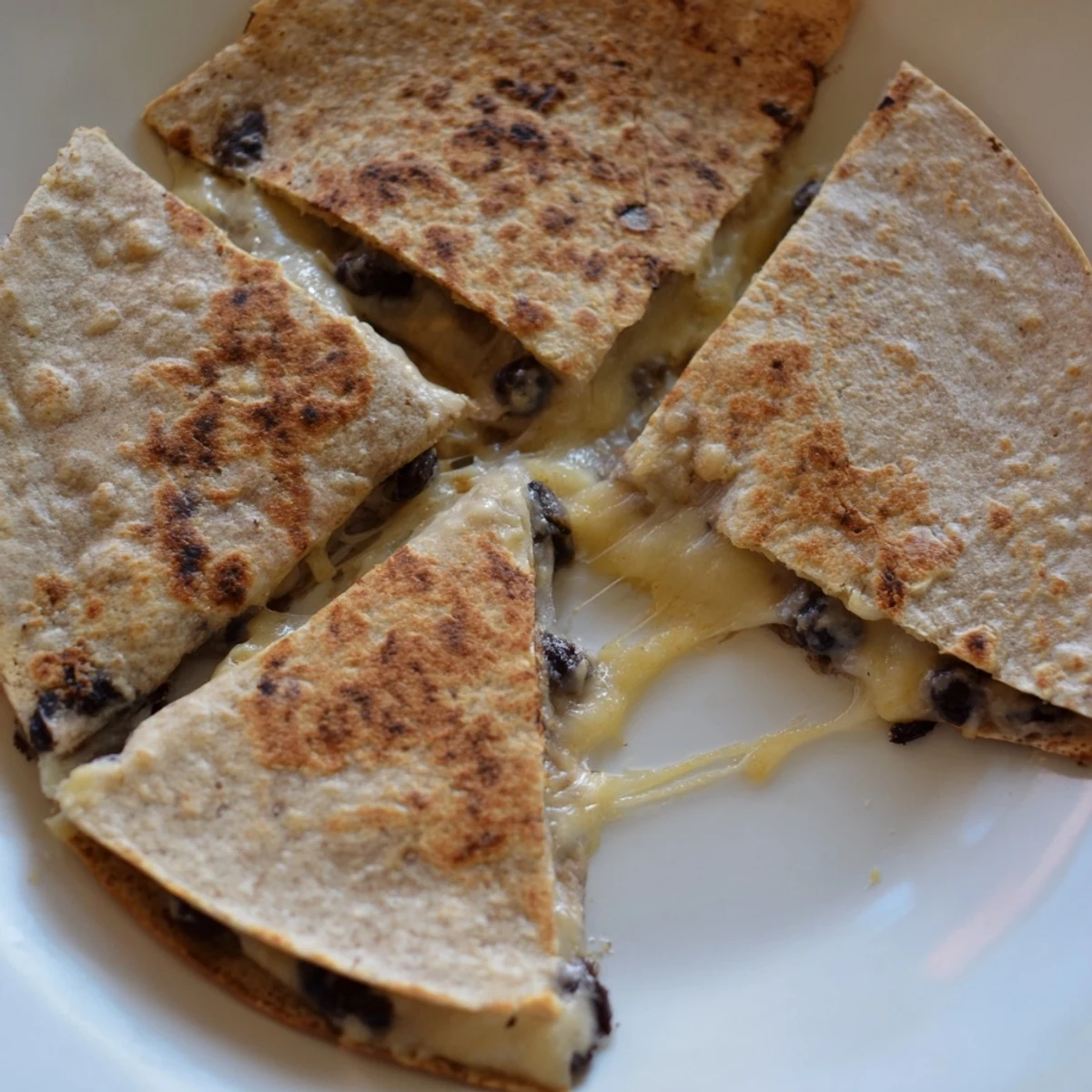 Golden, crispy Bean & Cheese Quesadillas, a delightful lunch featuring melted cheese and warm tortillas.
