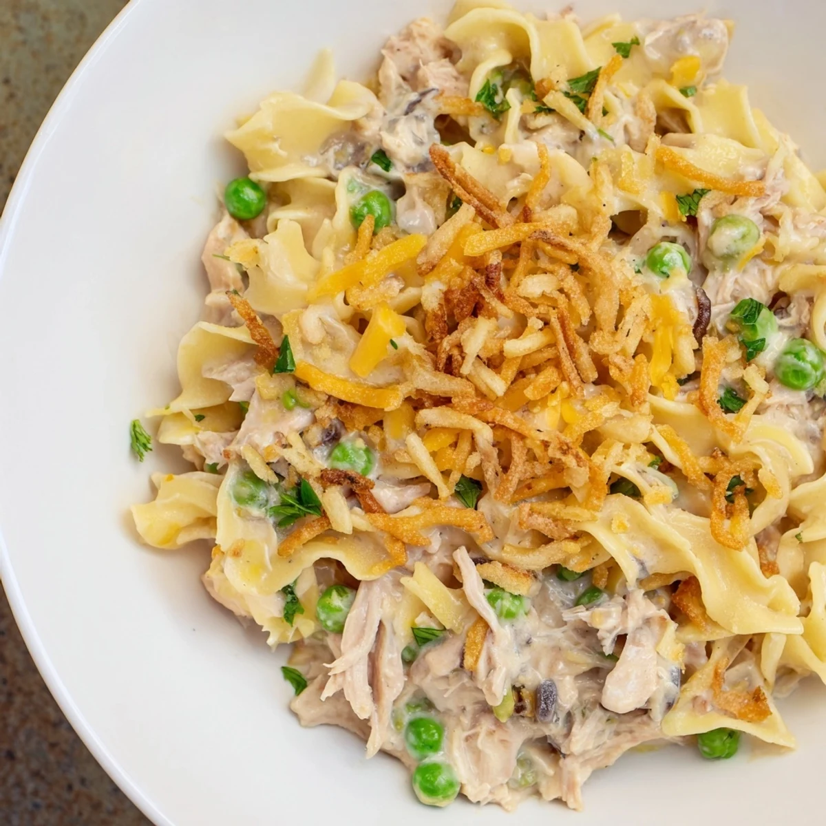 A close-up of a hearty tuna noodle casserole: a comforting family favorite with a delicious aroma.