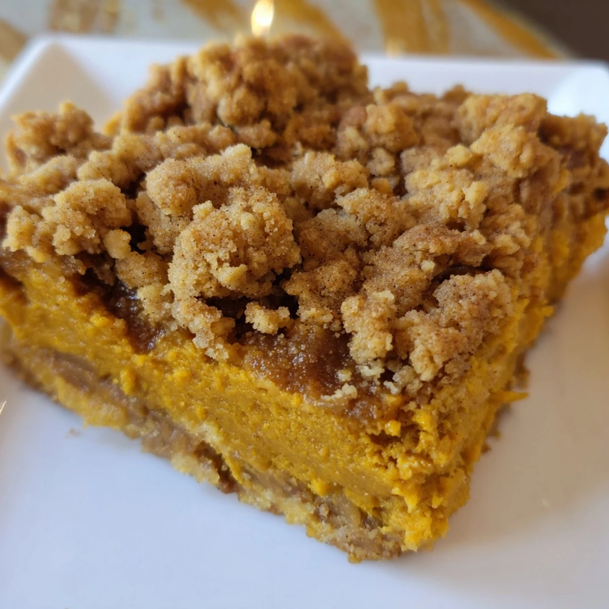 Warm pumpkin crisp bubbling in a baking dish, ready for a comforting fall dessert.