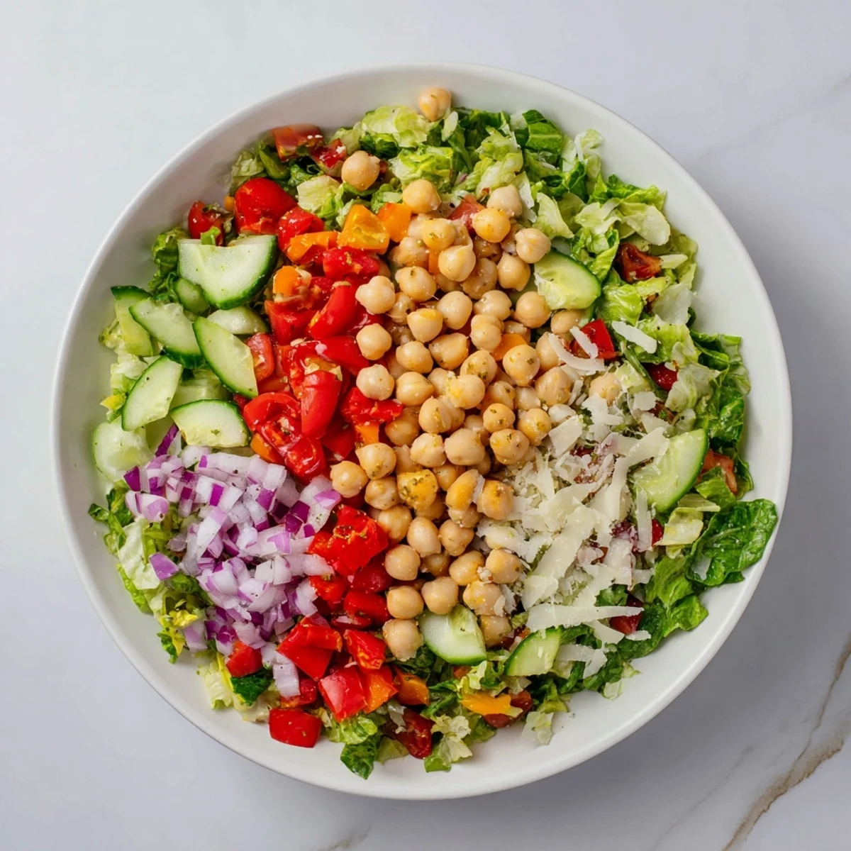 A colorful bowl of La Scala chopped chickpea salad, ready for a delicious, fresh lunch.