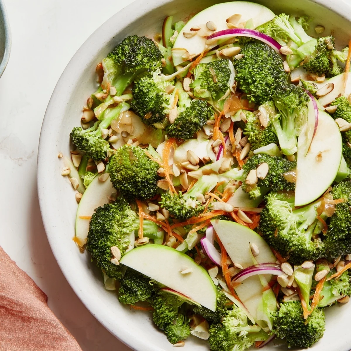 A vibrant Broccoli and Apple Hot Girl Salad, with bright green broccoli florets and apple slices.