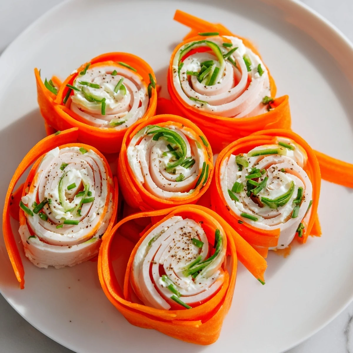 Fresh "Ribbon Dancer" rolls are visually stunning, with turkey slices wrapped in colorful vegetables on a platter.