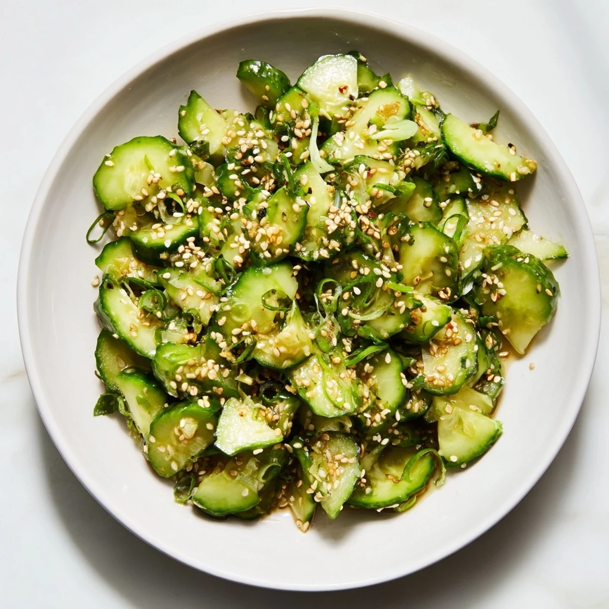 The refreshing Cucumber Shaker is bursting with flavor, sprinkled with sesame seeds, ready to enjoy.