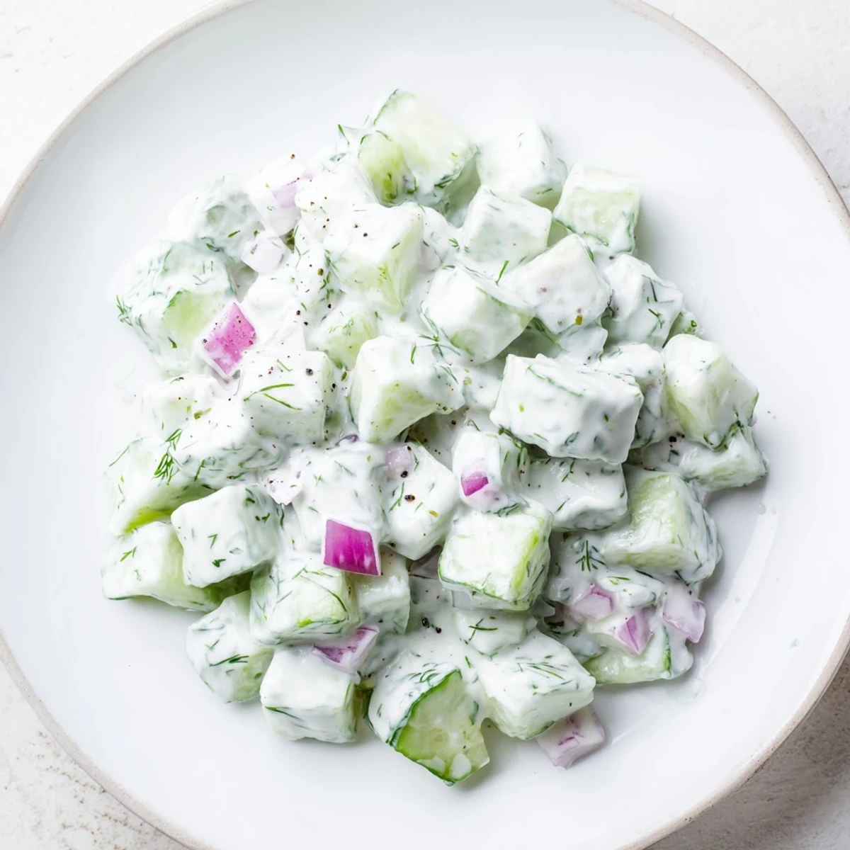 Enjoy the light, cool taste of this homemade Cucumber and Greek Yogurt Tzatziki Salad, perfect for summer.