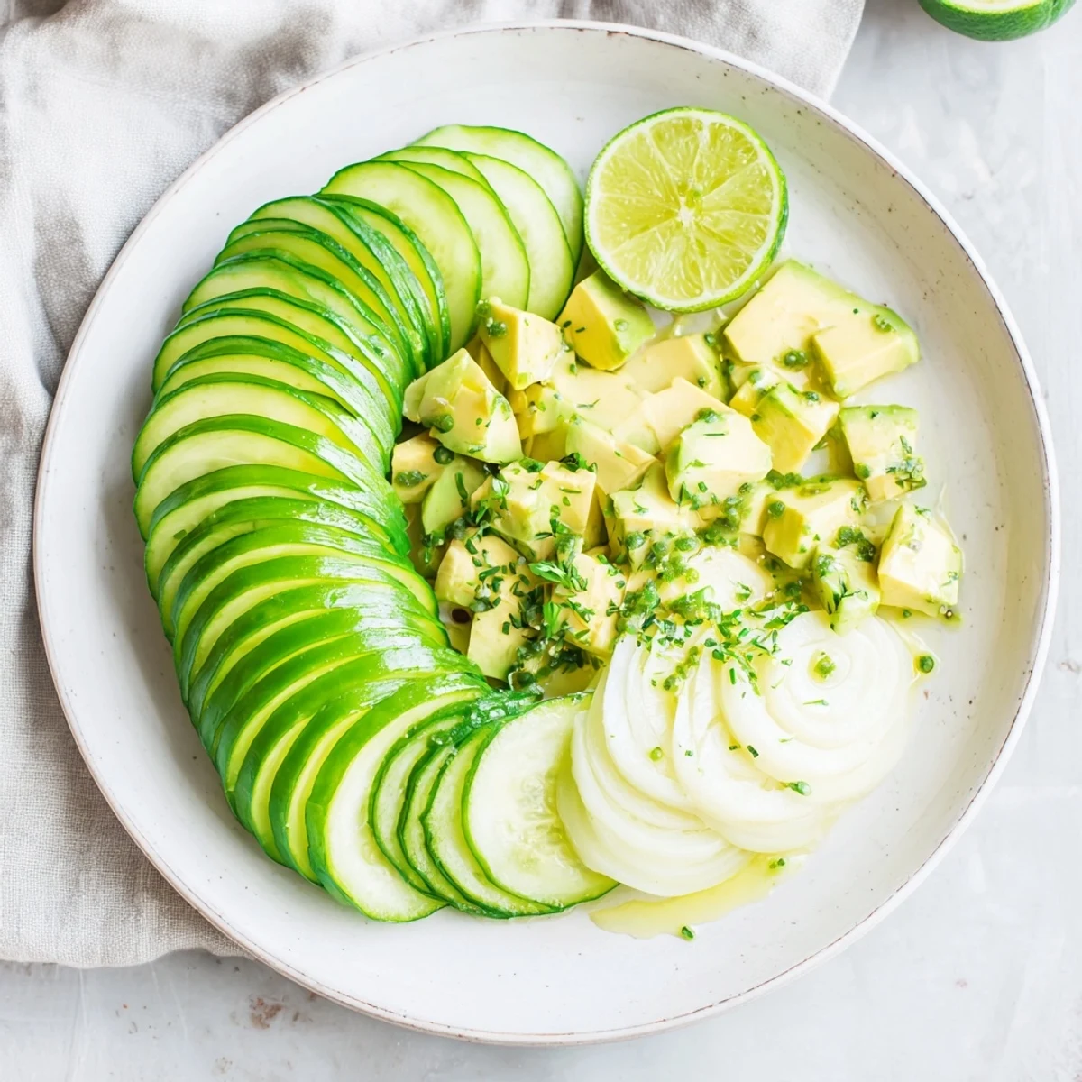 A vibrant Cucumber and Tinned Fish Salad with creamy avocado, ready for a date night meal.