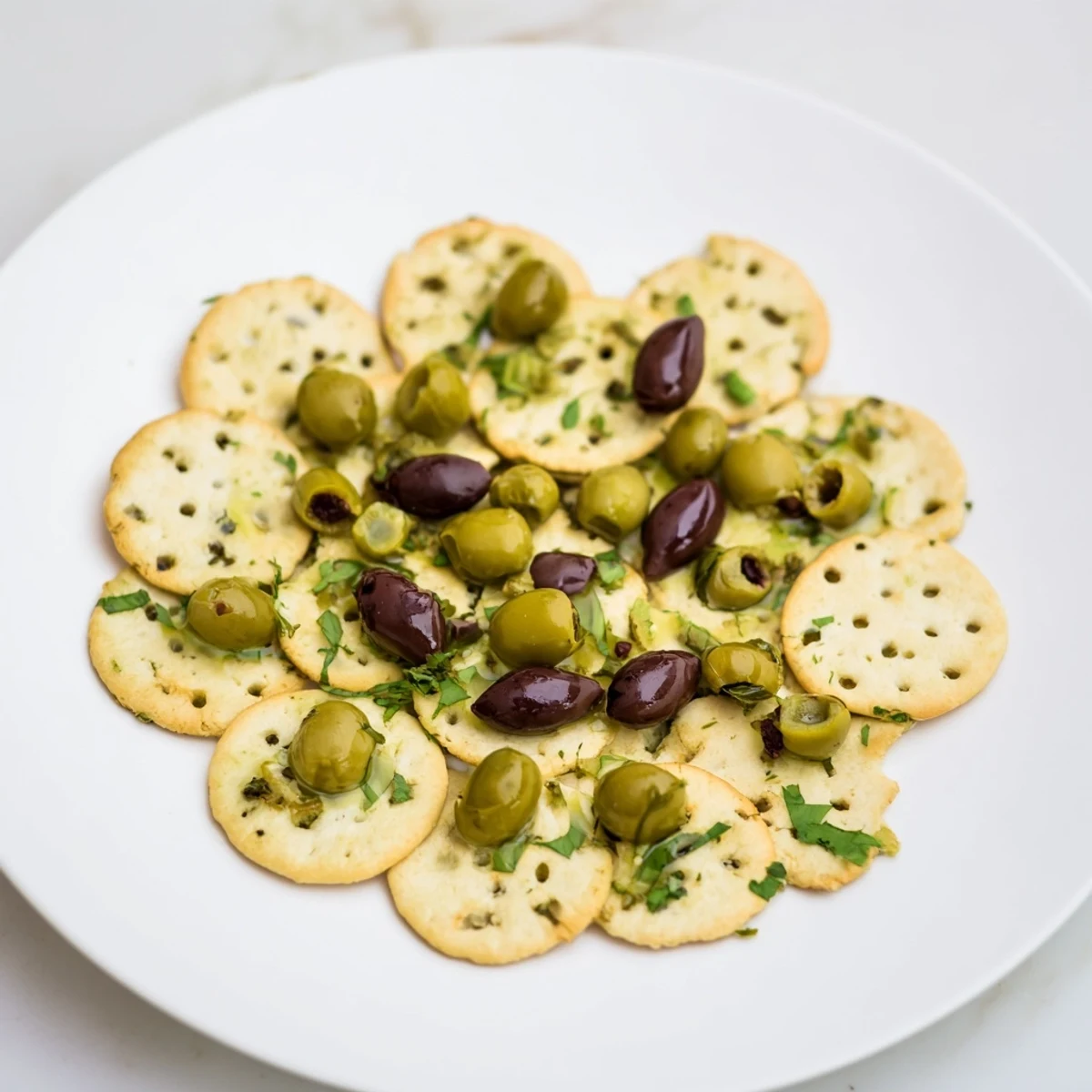 Cobblestone Courtyard appetizer, round crackers and olives arranged to resemble a charming European street.