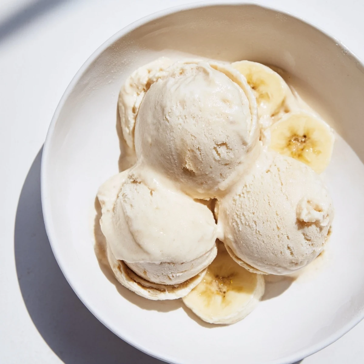 A close-up of creamy, delicious 2-Ingredient Banana Ice Cream served in a bowl.