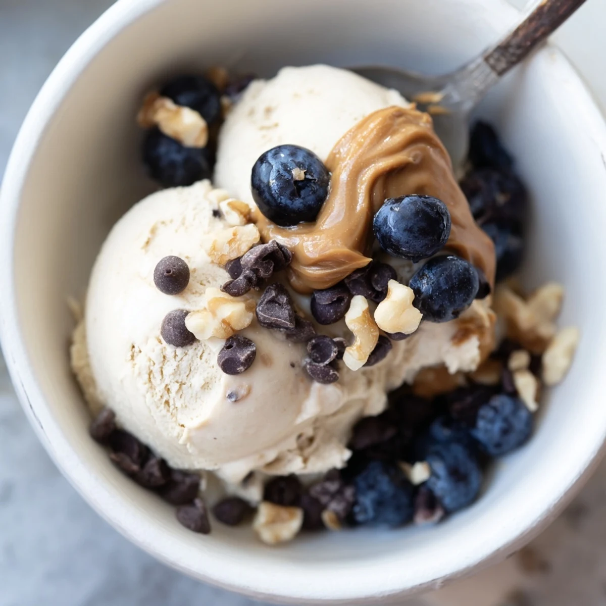 Vibrant photo of a homemade Protein Ice Cream Bowl, creamy and ready for delicious, healthy toppings.