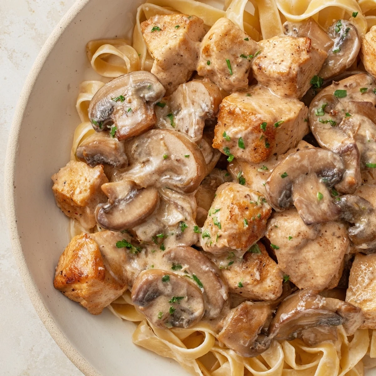 Perfectly cooked fettuccine coated in rich, creamy sauce with flavorful Creamy Mushroom Chicken Pasta.
