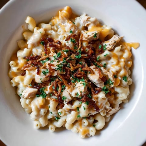 One-Pot Honey BBQ Chicken Mac and Cheese, bubbling and cheesy, with a sprinkle of fresh parsley.
