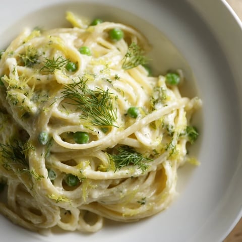 Creamy Dill Pasta: A close-up of a bowl, the pasta glistening with a rich, creamy sauce.