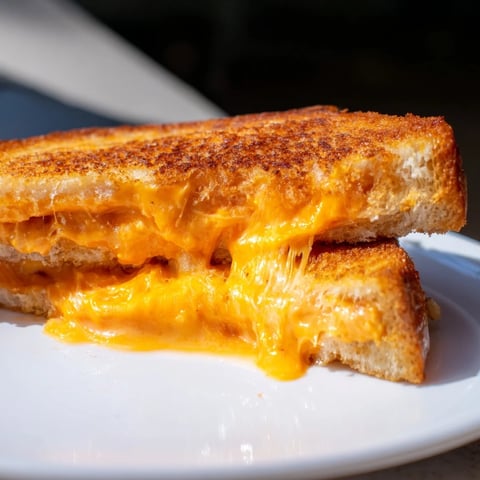 Golden brown and crispy, this Spiked Grilled Cheese is oozing with melted cheddar and Monterey Jack.