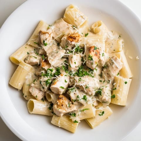 Golden chicken pieces and perfectly cooked rigatoni coated in rich creamy garlic Parmesan sauce.