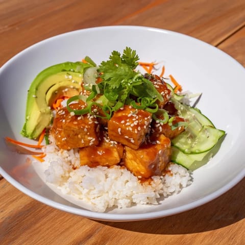 These vibrant Chili-Mayo Baked Tofu Bowls feature crisp tofu coated in a spicy homemade sauce, delicious and satisfying.