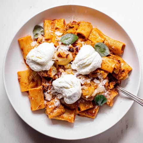 A close-up view of Creamy Roasted Red Pepper Santa Hat Pasta, ready for a delicious holiday meal.