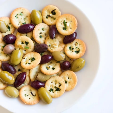 Appetizing Cobblestone Courtyard, featuring a creative platter of crackers and assorted, savory olives.