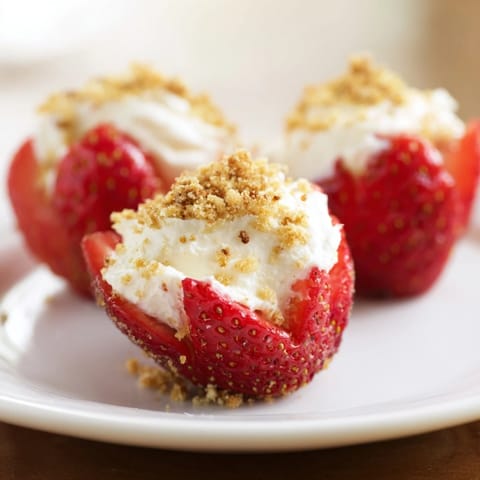 Close-up of Cheesecake Stuffed Strawberries; a delicious no-bake dessert ready to eat.