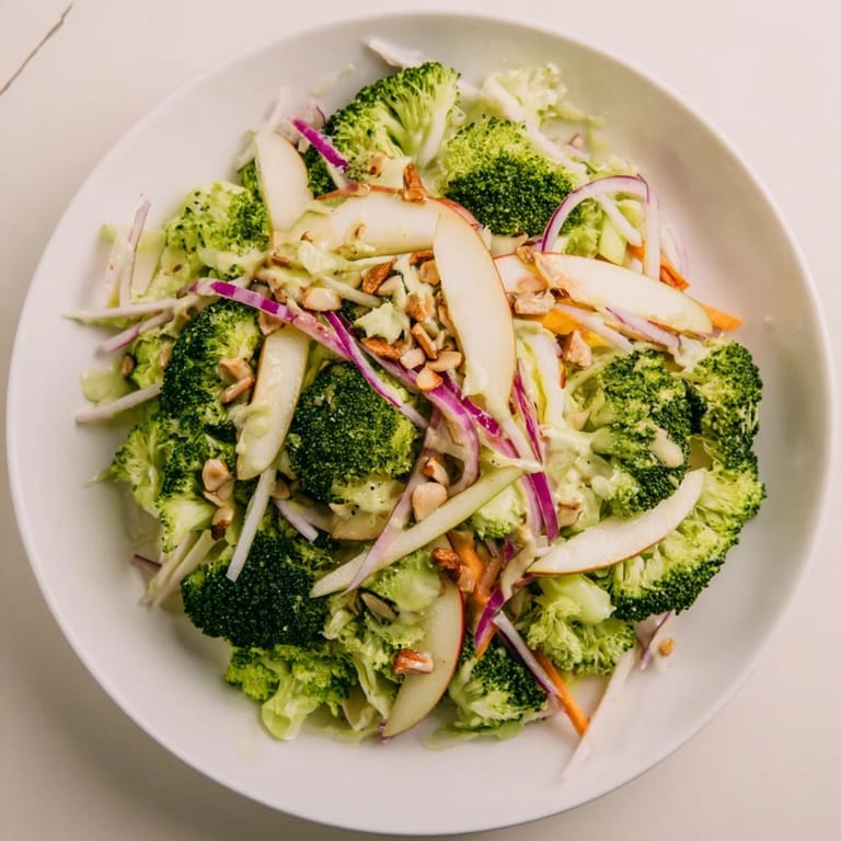 This Broccoli and Apple Hot Girl Salad shows fresh ingredients tossed in a zesty, homemade dressing.