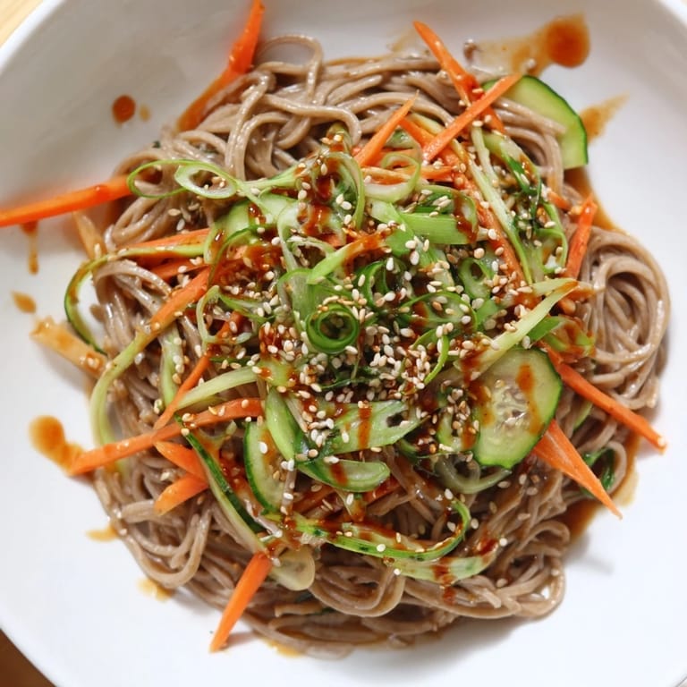 Vibrant Chilled Noodle Lunch Cups, showcasing crisp cucumber and carrots, ideal for a cooling vegetarian meal.