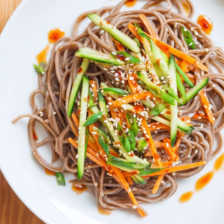 Image of fully-assembled Chilled Noodle Lunch Cups ready to eat, with glistening noodles and fresh garnishes.