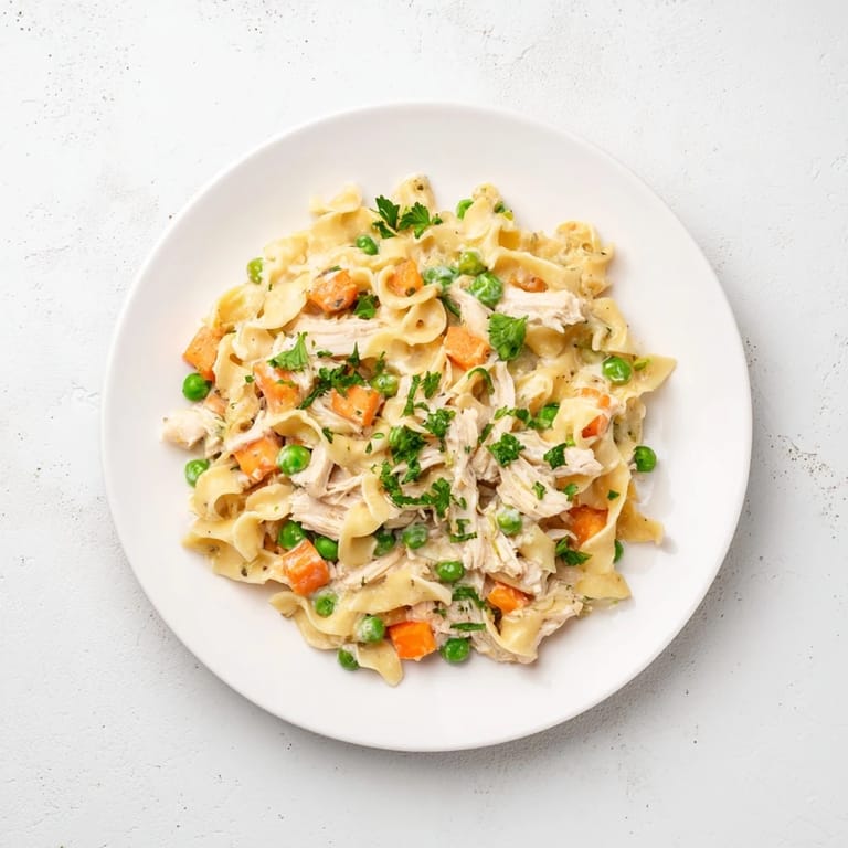 A family-friendly one-pan meal, this Spring Chicken Noodle Skillet features comforting noodles and colorful vegetables glistening in a savory sauce.