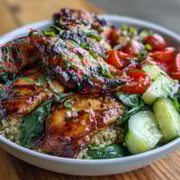 Lemon vinaigrette grilled chicken and veggie bowl with juicy chicken, fresh greens, and tangy lemon dressing.